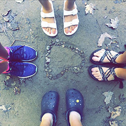 Rocks in the shape of a heart with friends.
